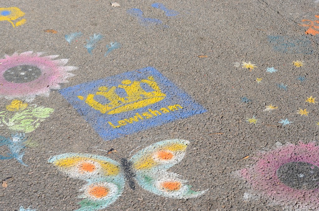 Pretty pavement art in Mountsfield Park - butterflies, flowers and the Lewisham Council logo