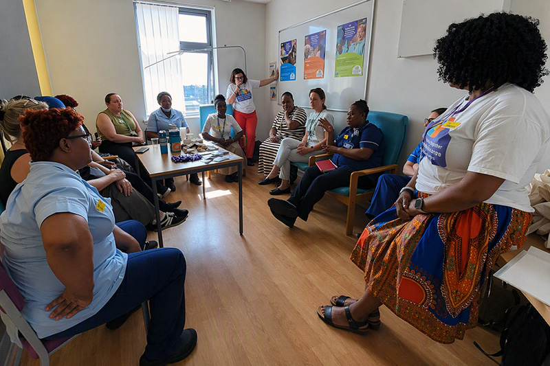 Hospital ward staff, care home representatives and campaign team members take part in a group discussion during a South East London campaign visit focused on improving hospital-to-care-home discharge processes.