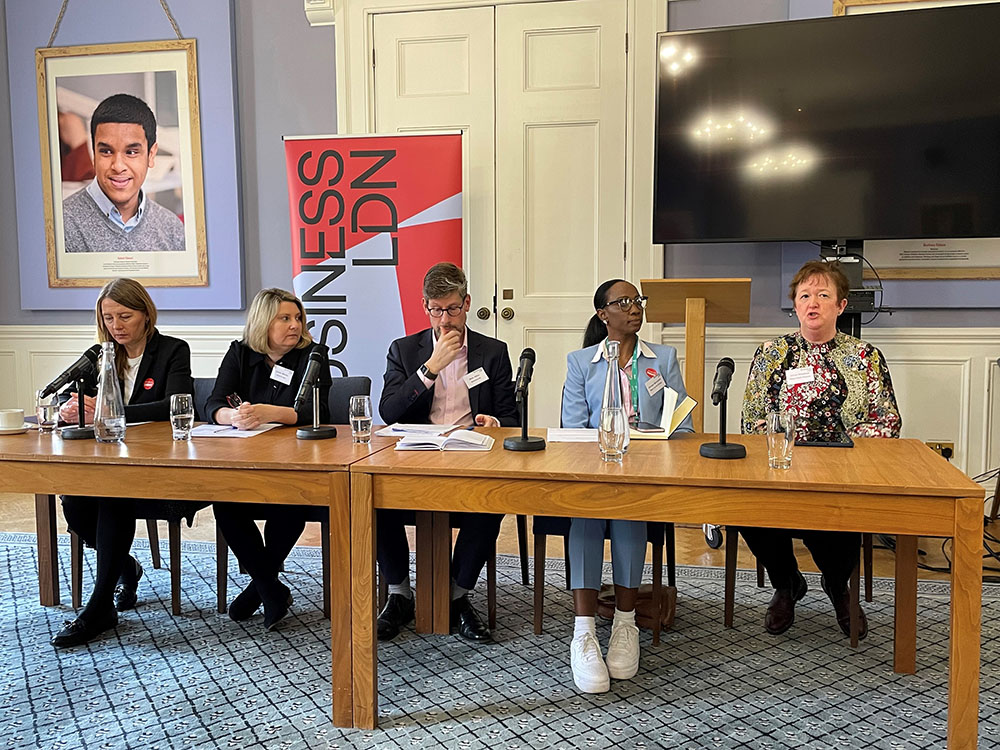 A panel of people at an event. Left to right: • Lizzie Smith, Interim Regional Director of Workforce, Training and Education - London, NHS England • Louise Whitley, Head of Area (London and South East), Skills for Care • Mark Hilton, Policy Delivery Director, BusinessLDN • Carolyn Moncrieffe, Director in Health Care & Science, West Thames College. • Jacqui Wakefield, SEL ICS Clinical and Care Professional Lead for Education