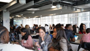 A room full of people attending a workshop